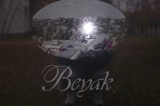 Gravestone for Tony (& Lynn) Beyak at McInnes Creek Chapel/Church.  This picture portrays the view of the back side.: This picture portrays the view of the back side of the gravestone with our resort etched lovingly into the stone.