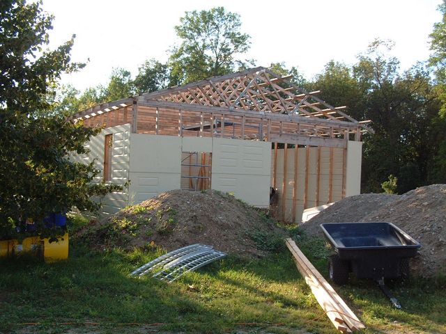 New garage being built by lodge : 2.5 year project with "loading doors" from Menards, International Falls Minnesota & gravel from Miller Contracting in Morson Ontario